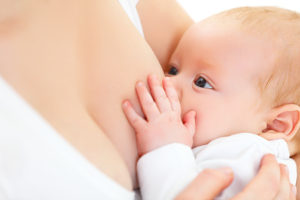 happy baby breastfeeding