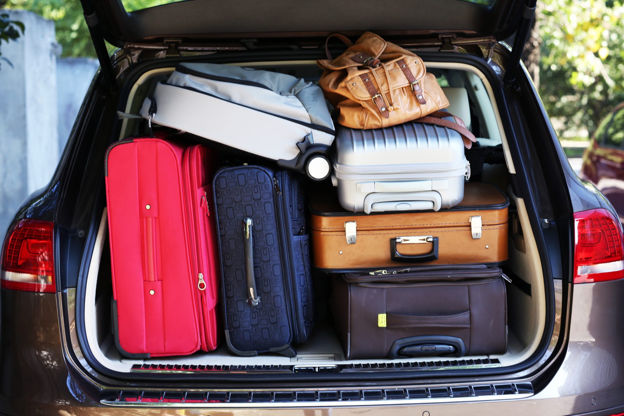 suitcases and bags in the trunk of the car