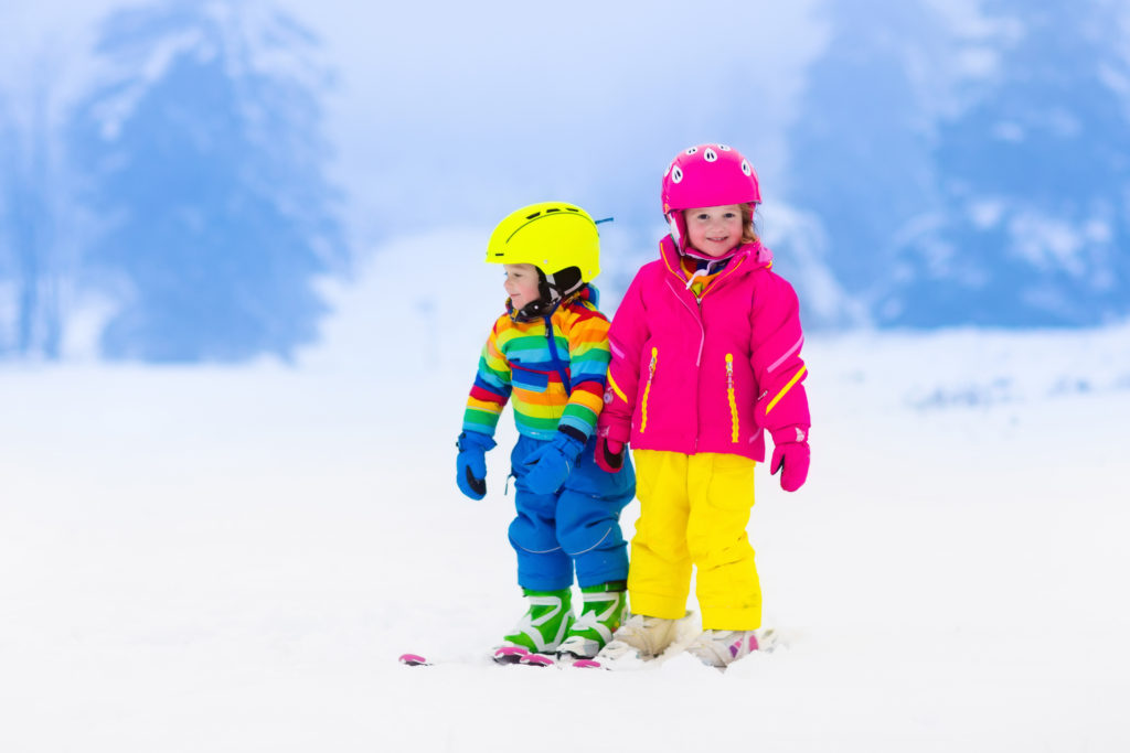 children skiing in the mountains