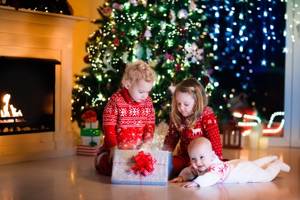 kids with presents under the xmas tree